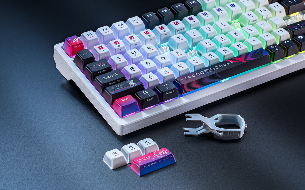ROG Azoth X focus view with R,O,G, and enter keycaps removed and placed next to a keycap remover