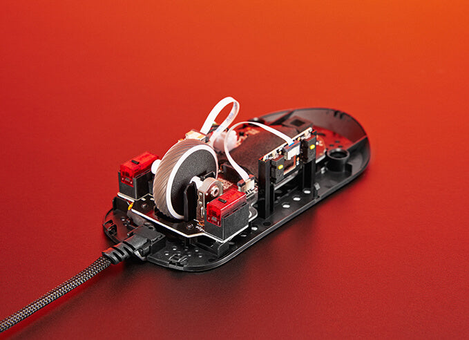 An ROG Keris Wireless AimPoint opened to reveal the ROG Micro switches inside