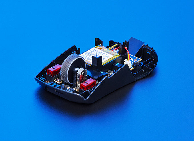 An ROG Keris Wireless AimPoint opened to reveal the ROG Micro switches inside