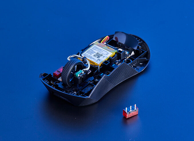 An ROG Gladius III Wireless AimPoint opened to reveal the sockets for swappable switches