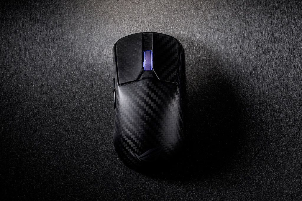 A close-up of the L/R buttons of the ROG Harpe Ace Extreme, with the scroll wheel shining a purplish glow