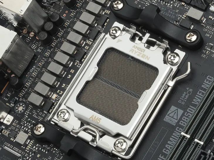 Close-up of an AM5 CPU socket on TUF GAMING B850I WIFI NEO.
