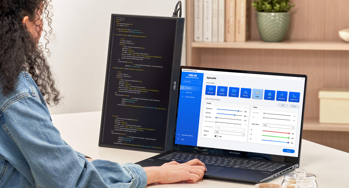 A software engineer is coding on a notebook and displaying on ZenScreen MB17AHG in a portrait mode