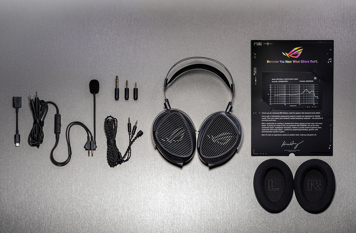 ROG Kithara gaming headset and included accessories laid out, including cables, swappable plugs, boom microphone, ear pads, and sound signature certificate
