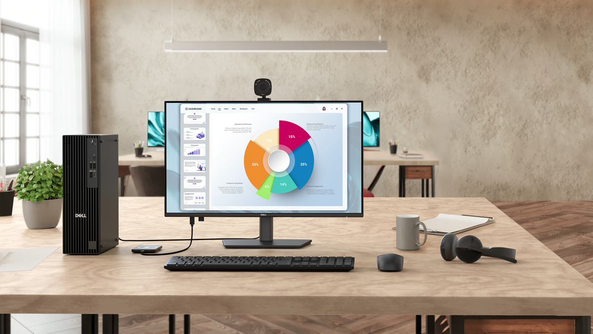 A Dell Pro 24 Plus monitor on a desk, along with accessories like a wireless mouse, keyboard, headphones, and more.