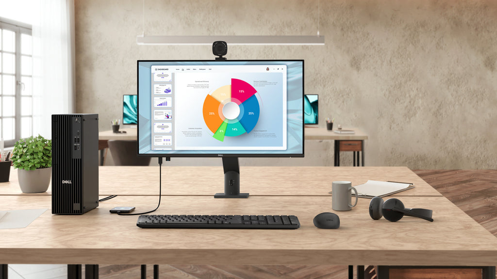 The Dell Pro P 24 Monitor - P2426H without stand on a desk with a desktop, webcam, keyboard, mouse, and headphones.