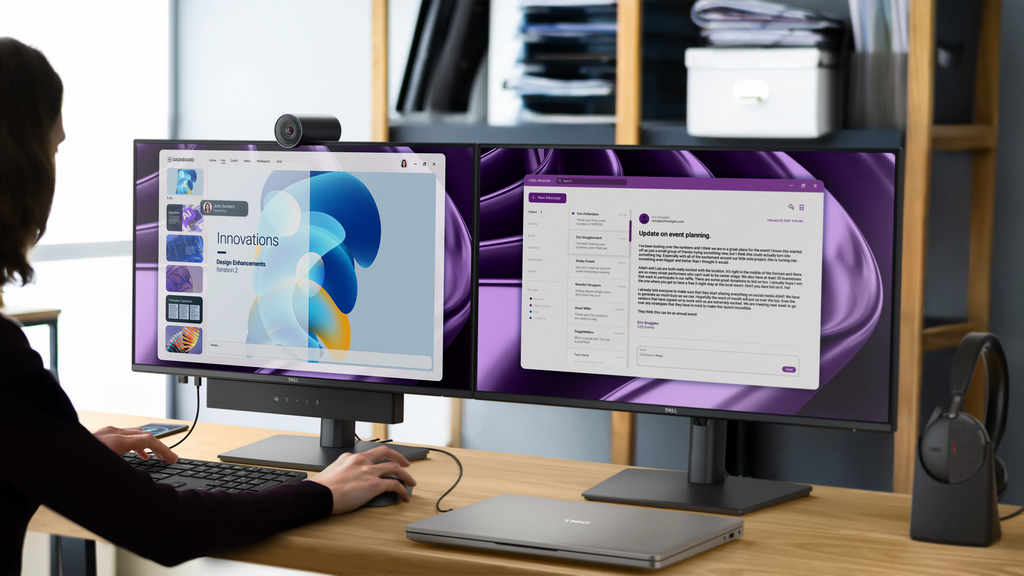 Two Dell Pro 24 Plus USB-C Hub monitors side by side on a desk along with accessories like a wireless mouse and more.