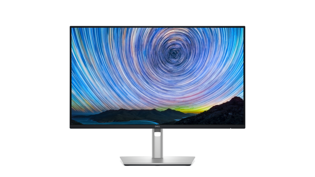 The Dell Pro 24 Plus QHD USB-C Hub Monitor with a screenfill showing mountains and a swirling starry sky.