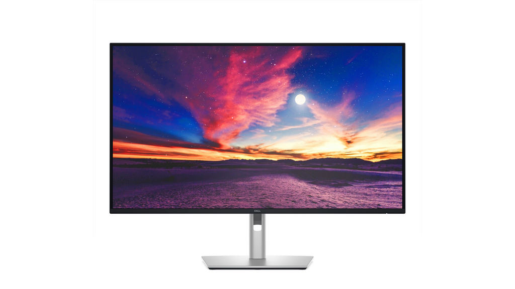 The Dell Pro 4K Plus 4K USB-C Hub Monitor with a screenfill showing a desert and a colorful sky.