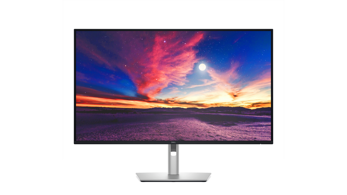 The Dell Pro 4K Plus 4K USB-C Hub Monitor with a screenfill showing a desert and a colorful sky.