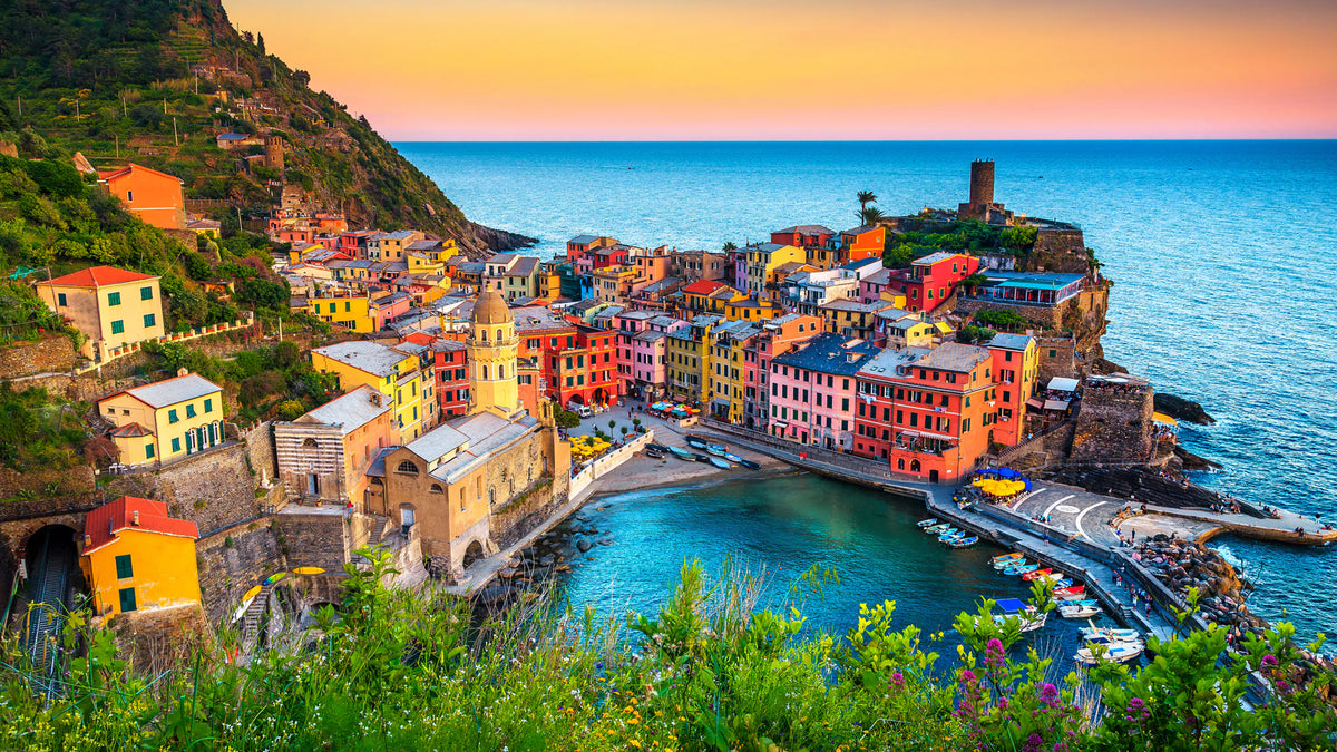 Oceanside town with colorful buildings.