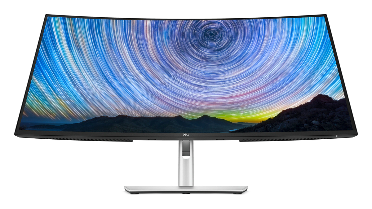 The Dell Pro 34 Plus USB-C Hub Monitor with a screenfill showing a desert and a colorful sky.