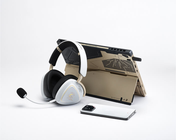 The Delta II KJP leaning against the back of the Flow Z13 KJP with an ROG phone placed next to the duo