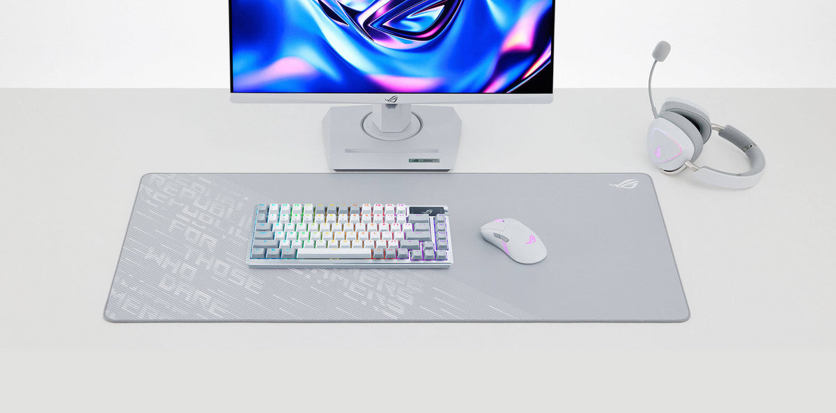 The ROG Scabbard II Arctic Gray placed upon a white table supporting a full white setup with the Keris II Origin, Azoth, and Delta II