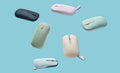 ASUS Marshmallow Mouse MD100 shown in six colors from left to right–Oat Milk, Green Tea Latte, Quiet Blue, Solar Blue, Lilac Purple and Brave Green. 