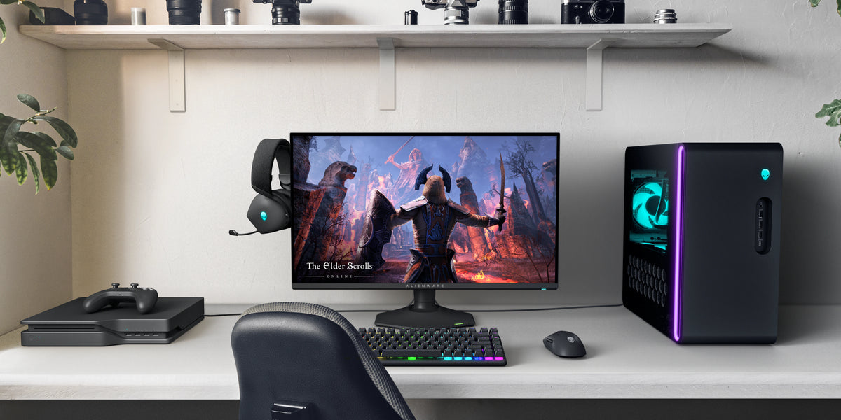Bedroom setup featuring Alienware AW2725QF Monitor, Alienware Desktop, Alienware Headset, Alienware Mouse &amp; Alienware Keyboard.