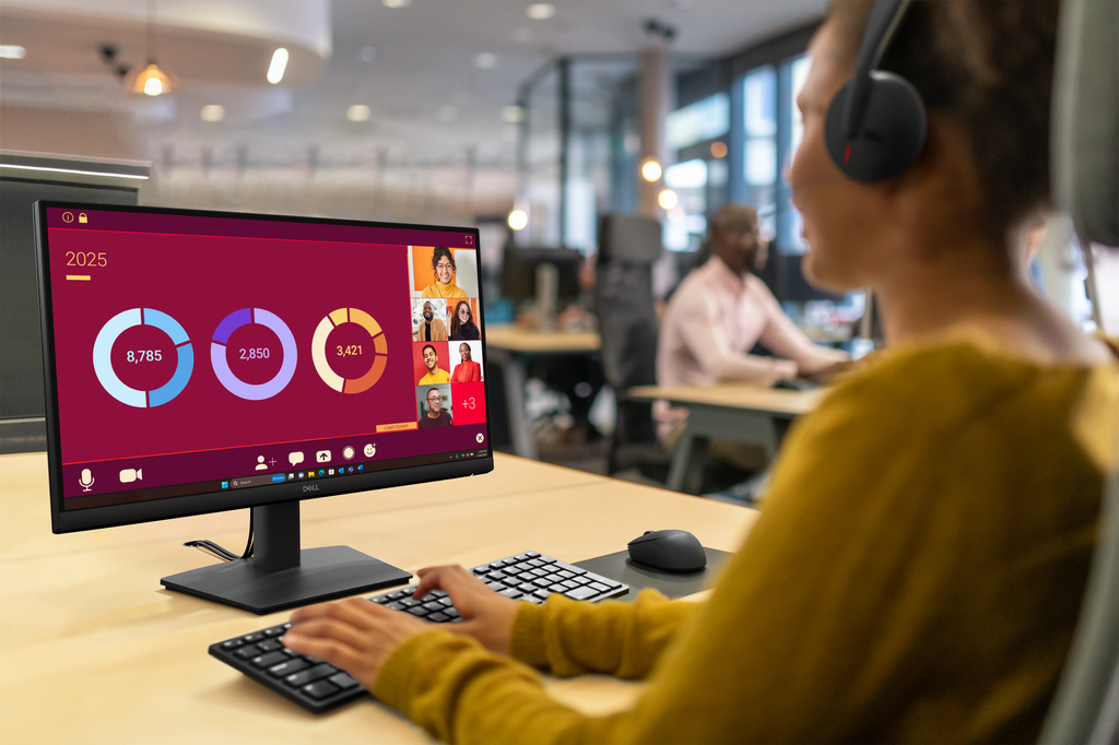 An office worker using a Dell Pro 22 Monitor to collaborate during a web conference.