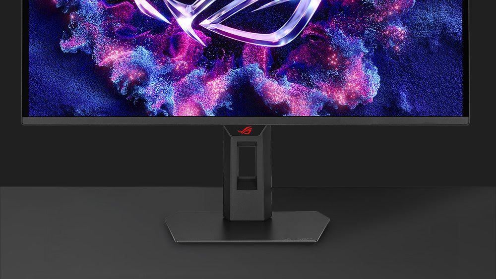 The front image of XG27AQDNG with a mobile phone on device groove